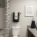 a bathroom with a sink toilet and towels