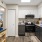 a kitchen with white cabinets